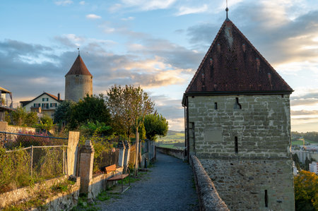 A tower on the old town walls of Romont in Switzerland taken at sunsetの写真素材