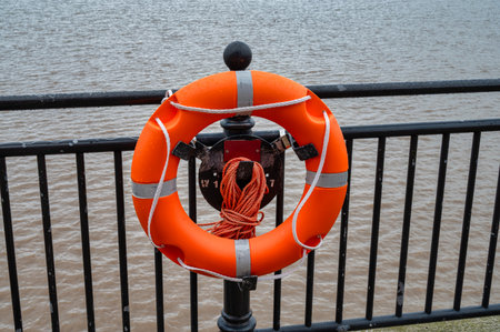 Orange life perserver at the pier in Liverpool England