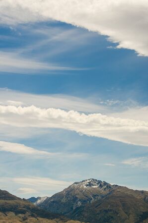 Mountain on blue cloudy skyの写真素材