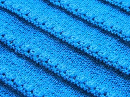 Openwork pattern with knitting needles. Aquamarine