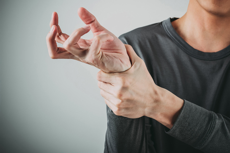 man wrist painの写真素材
