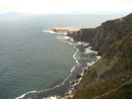 A magnificent view of cliffs and ocean from the hills at the Foger Cliffs, Valentia Island, Ring of Kerry, Irelandの写真素材