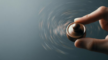 Hand holding a jar of perfume on a dark background with copy spaceの素材