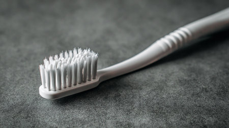 Toothbrush on a gray background, close-up, selective focusの素材