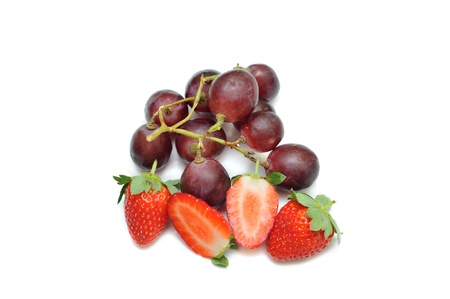 Strawberries and grapes isolated on white backgroundの写真素材