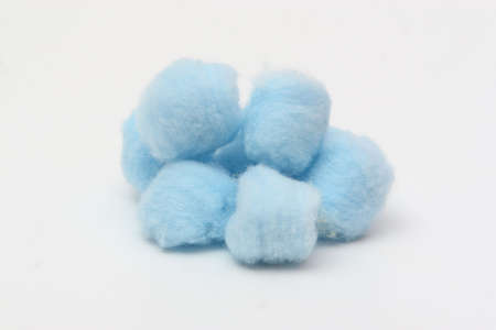 Blue hygienic cotton balls isolated on a white backgroundの写真素材