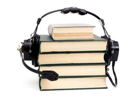 audiobook conception with headphones and booksの写真素材