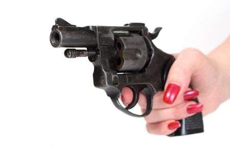 sixshooter in hand - isolated on white backgroundの写真素材