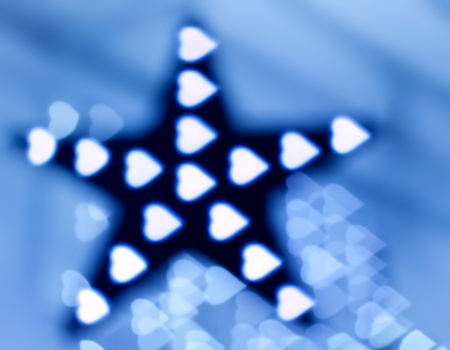 Decoration star and garland as heart lights, defocusedの写真素材