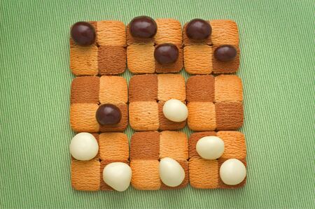 Sweet checkers of biscuits and chocolate dropの写真素材