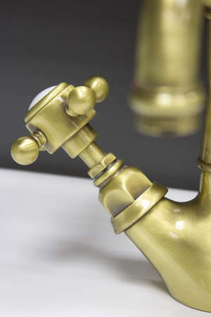 Retro-styled water bronze tap on sinkの写真素材