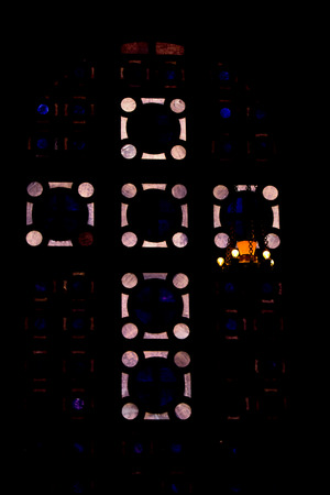 Icon lamp with  stained glass cross, church, darkness の写真素材