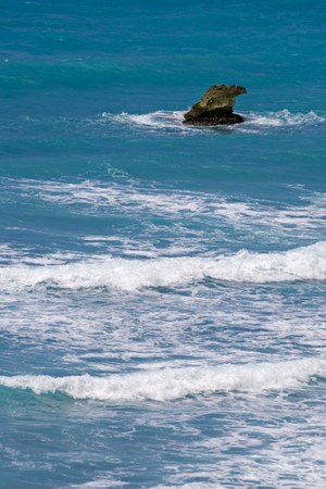 Rock in the Caribbean sea surfの写真素材