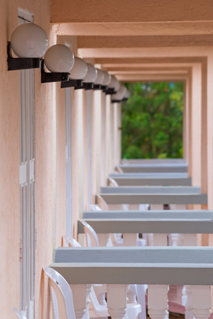 Balconies and lanterns row as pink tunnelの写真素材