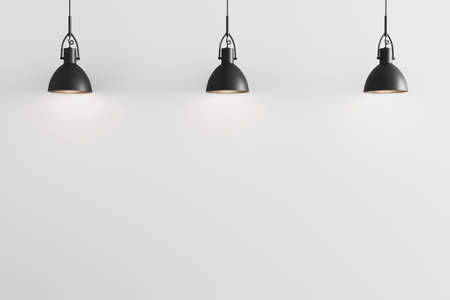 Three black pendant light on white wall background, ceiling lights, white wall with pendant lights...