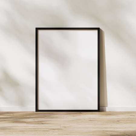 blank vertical black frame mock up, poster frame on wooden floor with sunlight with leaves shadow on...