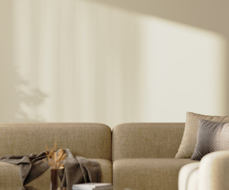 Empty beige wall mock-up with sunlight above brown sofa with pillows and decor, 3d renderの写真素材
