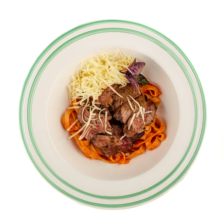 Spaghetti bolognese top view on a plate. Isolated on whiteの写真素材
