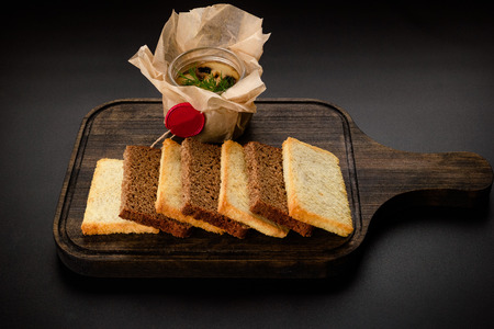 Homemade mushroom and bean paste. Pate in glass jar on rustic wooden table. Useful and healthy vegetarian food.の写真素材