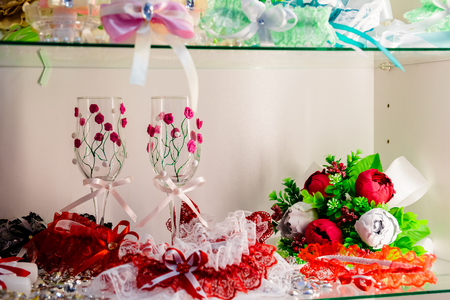 Accessory for the wedding. Candles. Wine glasses.Decorated wedding accessories A set of wedding accessories, decorated in Colored tapes and jewelryの写真素材