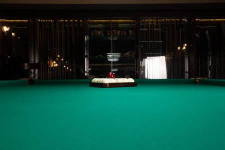Billards pool game. Green cloth table with white balls.