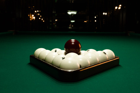 Billards pool game. Green cloth table with white balls. Close-up.
