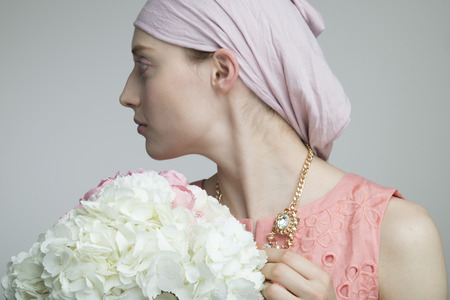 Woman with holding a flowers bouquetの写真素材