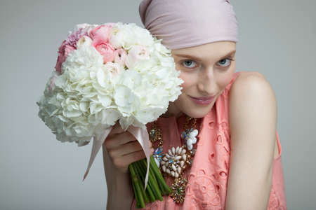 Woman holding a flower bouquetの写真素材