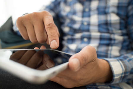 Men relaxing use the smartphone