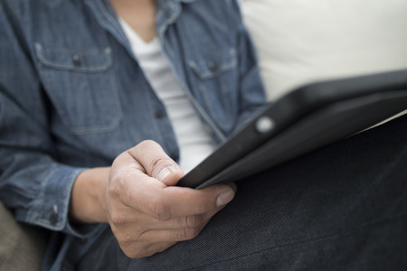 Hand of man with a tablet