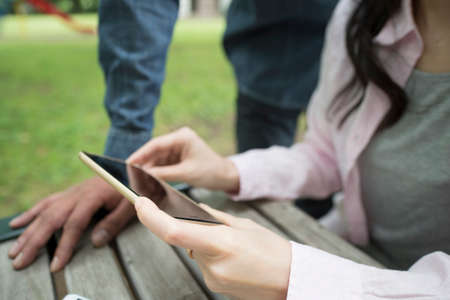 Couple to see one of the cell phone togetherの写真素材