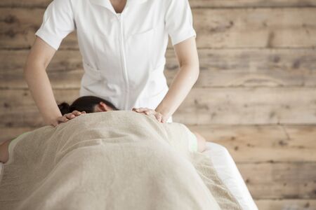 Woman to be massaging the shoulderの写真素材