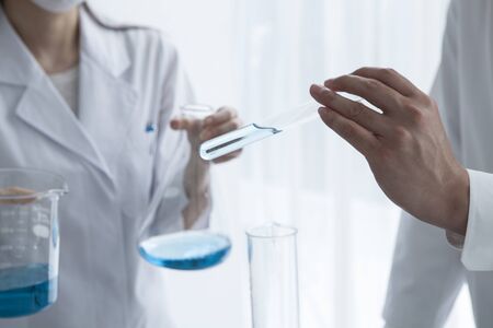 Male scientist with a test tubeの写真素材