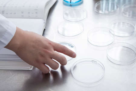 Male researcher to take in hand the dishの写真素材