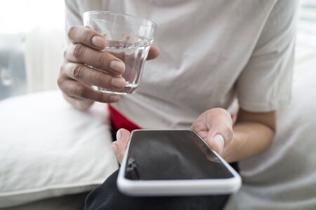 lose up of a man using mobile smart phone