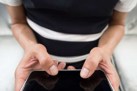 Close up of man using smart phone isolated on white background