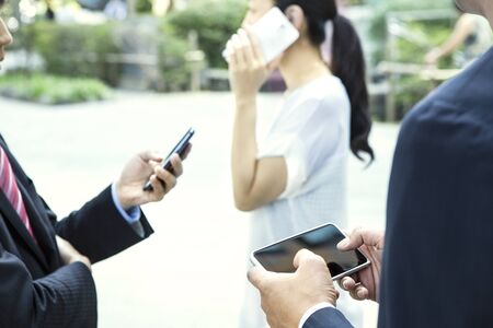 woman and man hands with smartphone and tablet pc