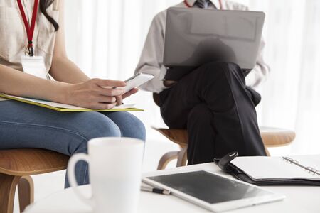 Men and women who are working together in a bright cafe
