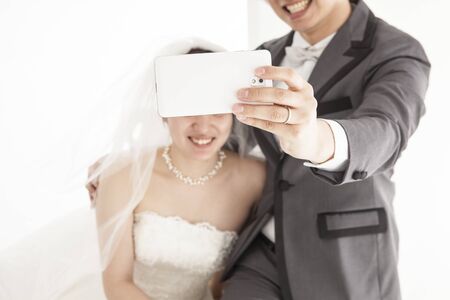 Couples take photos in weddingの写真素材