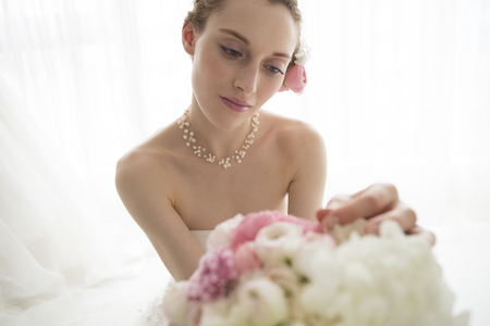 The bride has a large bouquetの写真素材