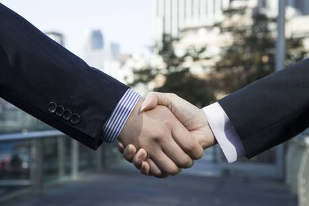 Office workers shaking hands
