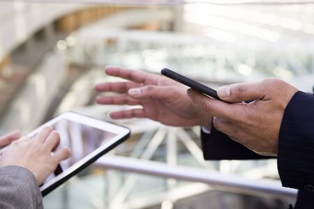 A man and a woman to use a smartphoneの写真素材