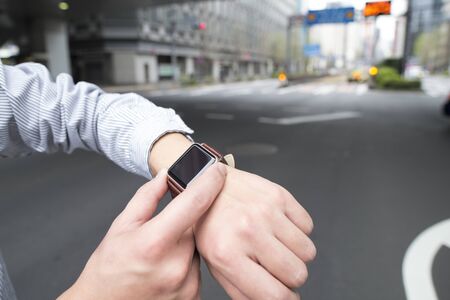 On the street with the smart watch.