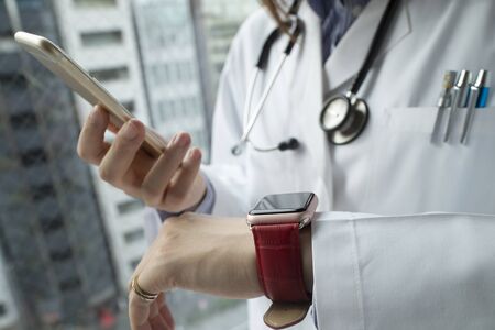 Smart watch, fashionable to shine a white coat.の写真素材