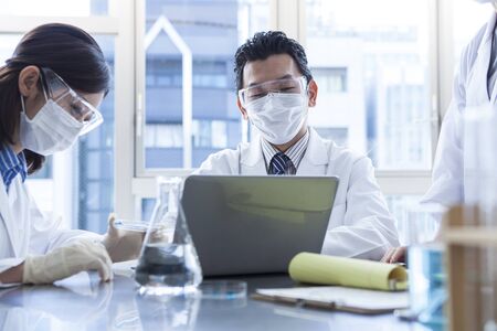 Scientists to discuss the research results of today.の写真素材