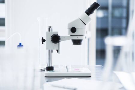 Scientific microscope in laboratory.