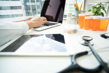 Doctors do research on laptop computers.の写真素材