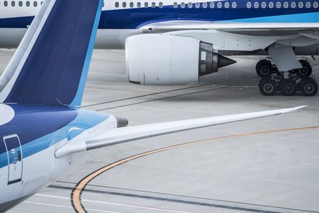 Close-up photograph of an airplane stopped at the airport.