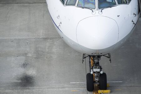 Close-up photograph of an airplane stopped at the airport.の写真素材