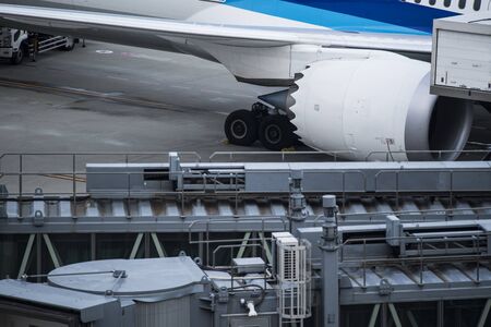 An airplane undergoing maintenance at the airfield.